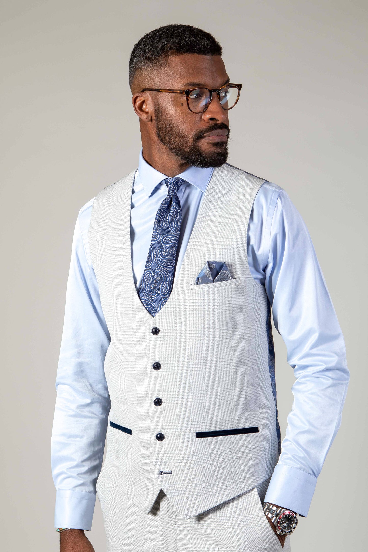 Man wearing men's BROMLEY - Stone Single Breasted Check Waistcoat - Marc Darcy Menswear