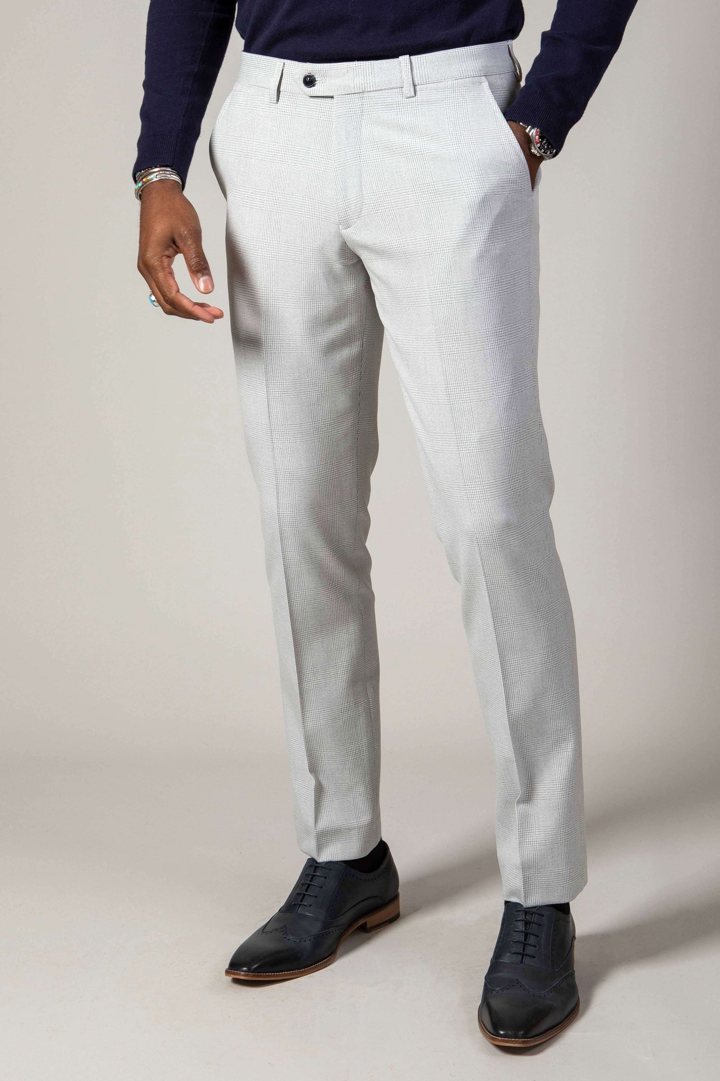 Man wearing men's BROMLEY - Stone Check Trousers - Marc Darcy Menswear