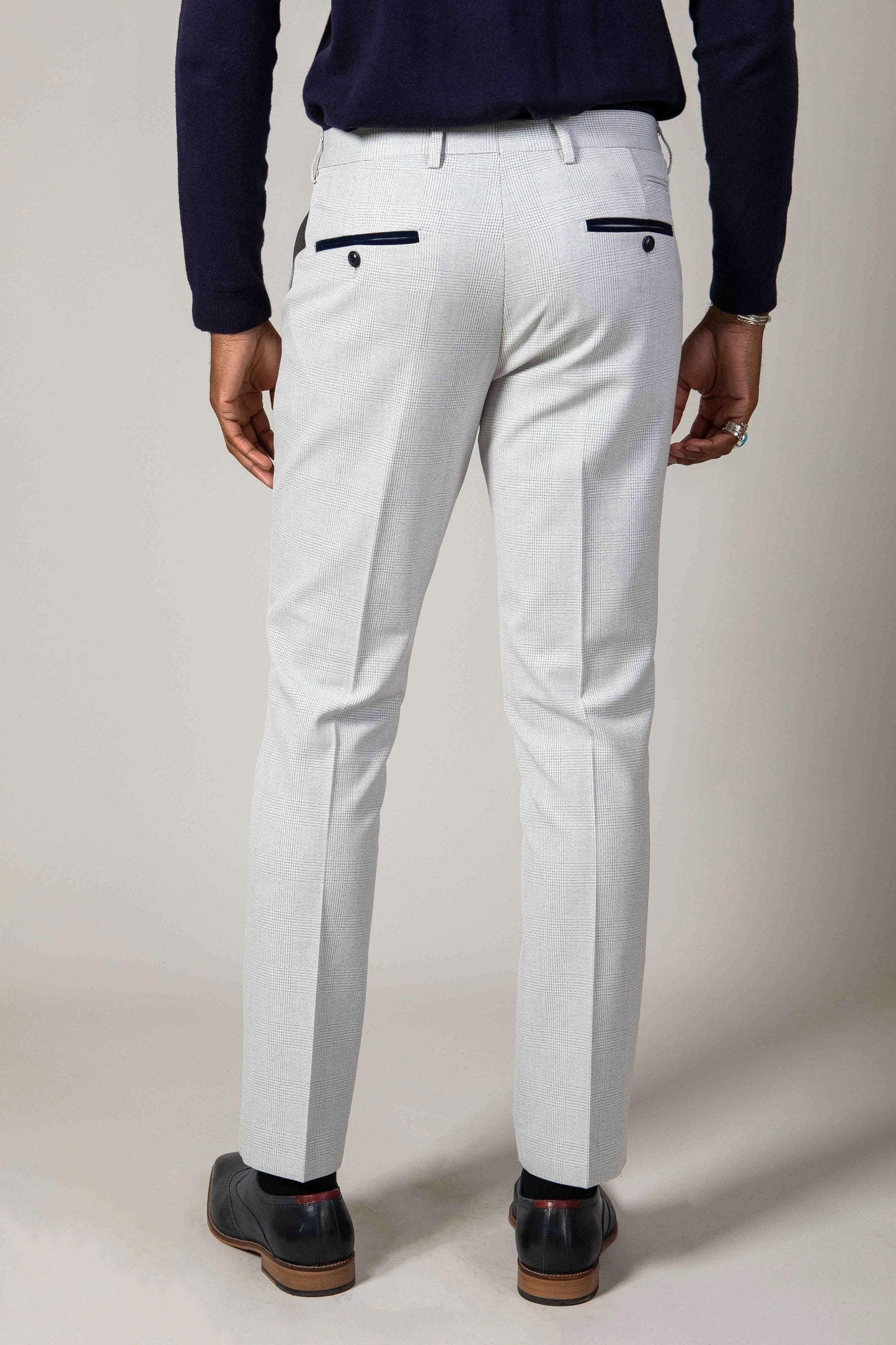 Man wearing men's BROMLEY - Stone Check Trousers - Marc Darcy Menswear