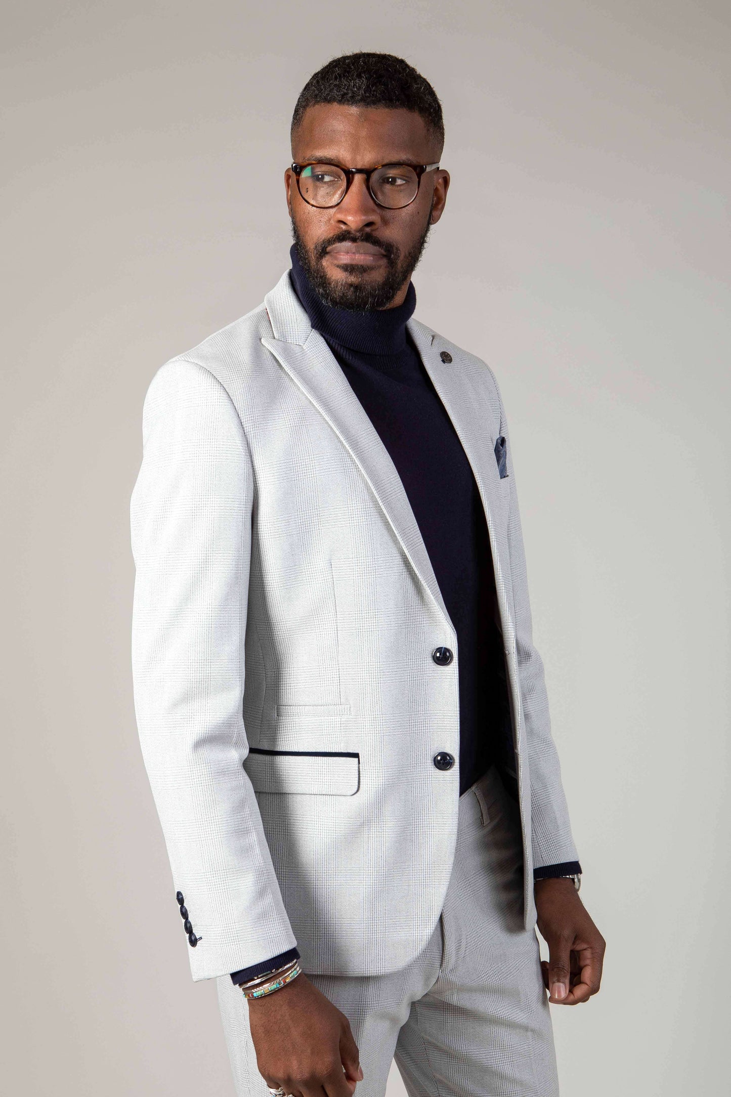 Man wearing men's BROMLEY - Stone Check Blazer - Marc Darcy Menswear