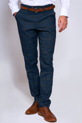 Man wearing men's JENSON - Marine Navy Check Trousers - Marc Darcy Menswear