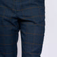 Man wearing men's JENSON - Marine Navy Check Trousers - Marc Darcy Menswear