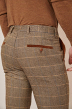 Man wearing men's TED - Tan Tweed Check Trousers - Marc Darcy Menswear