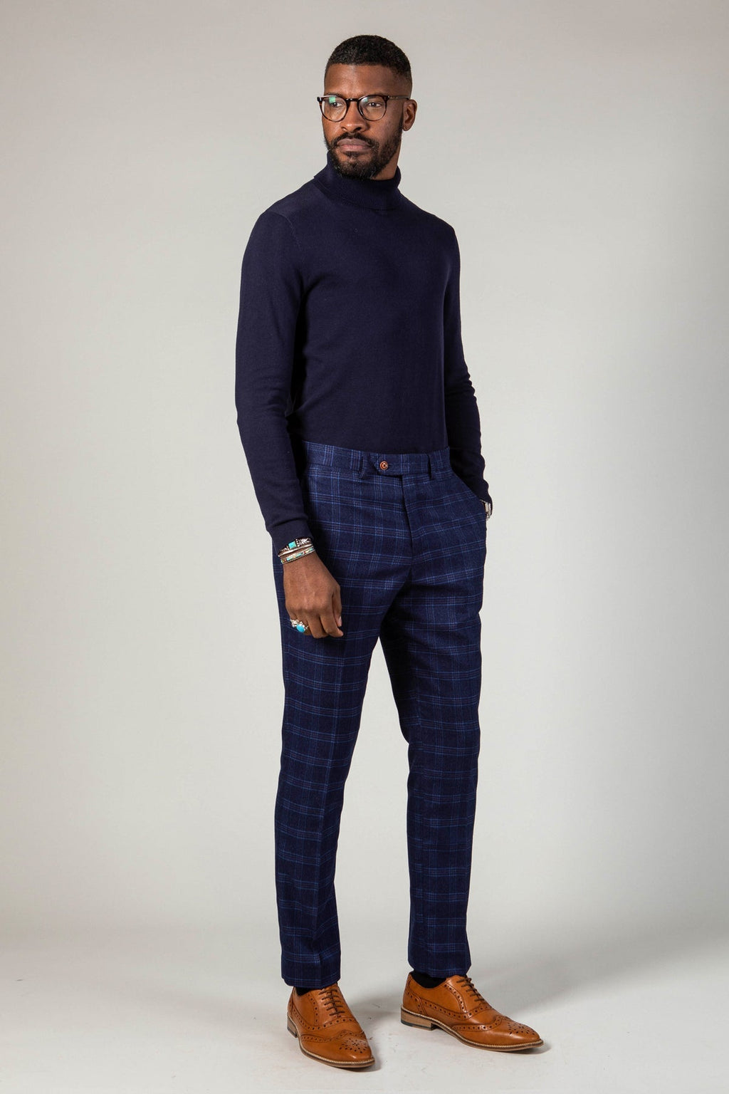 Man wearing men's CHIGWELL - Blue Tweed Check Trousers - Marc Darcy Menswear