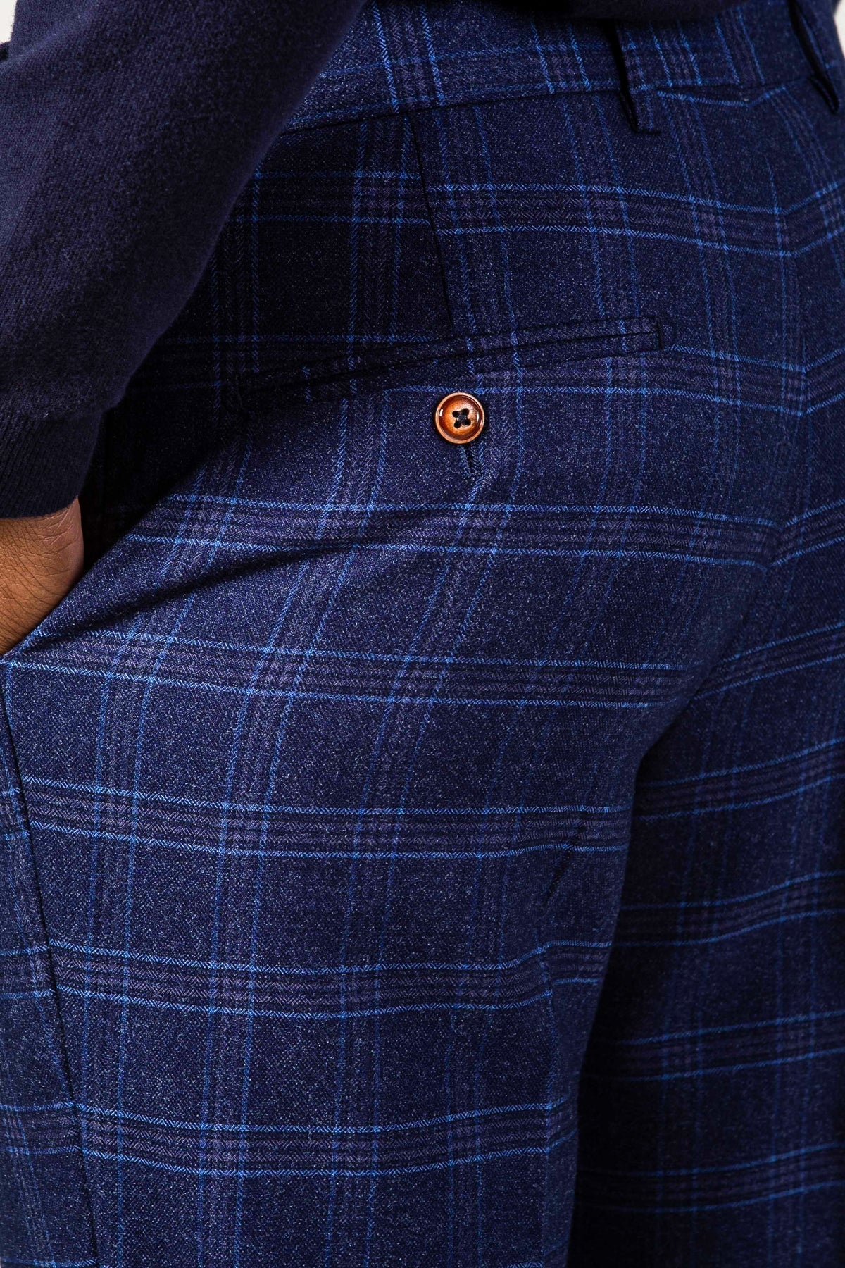 Man wearing men's CHIGWELL - Blue Tweed Check Trousers - Marc Darcy Menswear