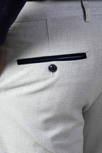 Man wearing men's BROMLEY - Stone Check Trousers - Marc Darcy Menswear