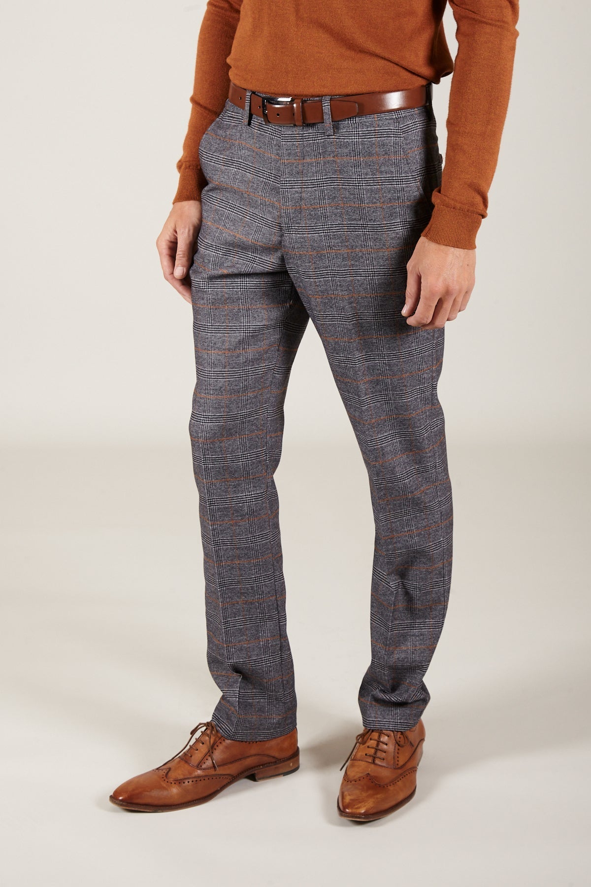 Man wearing men's JENSON - Grey Check Trousers - Marc Darcy Menswear