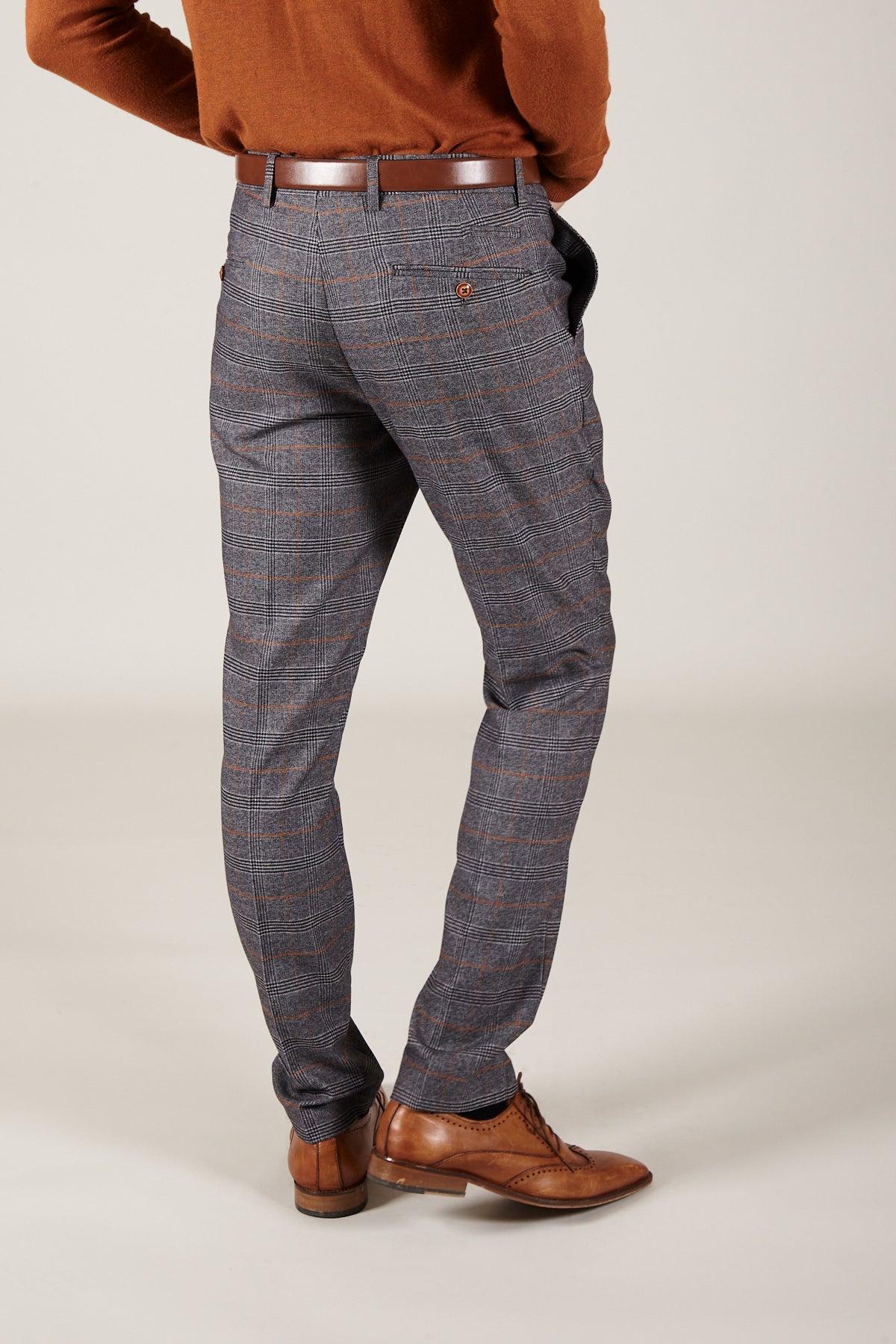 Man wearing men's JENSON - Grey Check Trousers - Marc Darcy Menswear