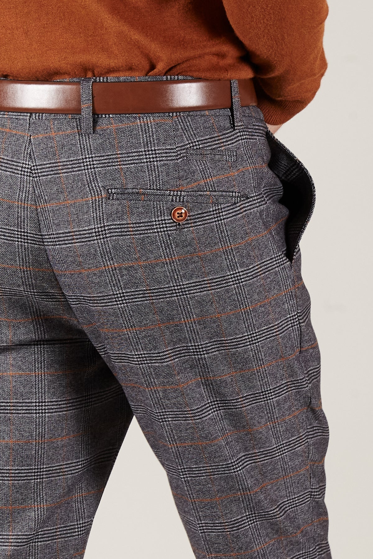 Man wearing men's JENSON - Grey Check Trousers - Marc Darcy Menswear