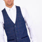 Man wearing men's HARRY - Indigo Single Breasted Tweed Check Waistcoat - Marc Darcy Menswear